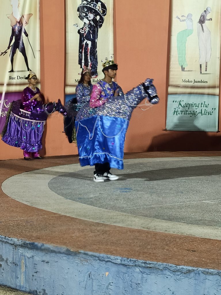 May be an image of text that says 'บอทร์ BlueDovil Blue Devil Roh MokoJumbies Moko Jumbies "Keeping the HeritagiAlive A Her'