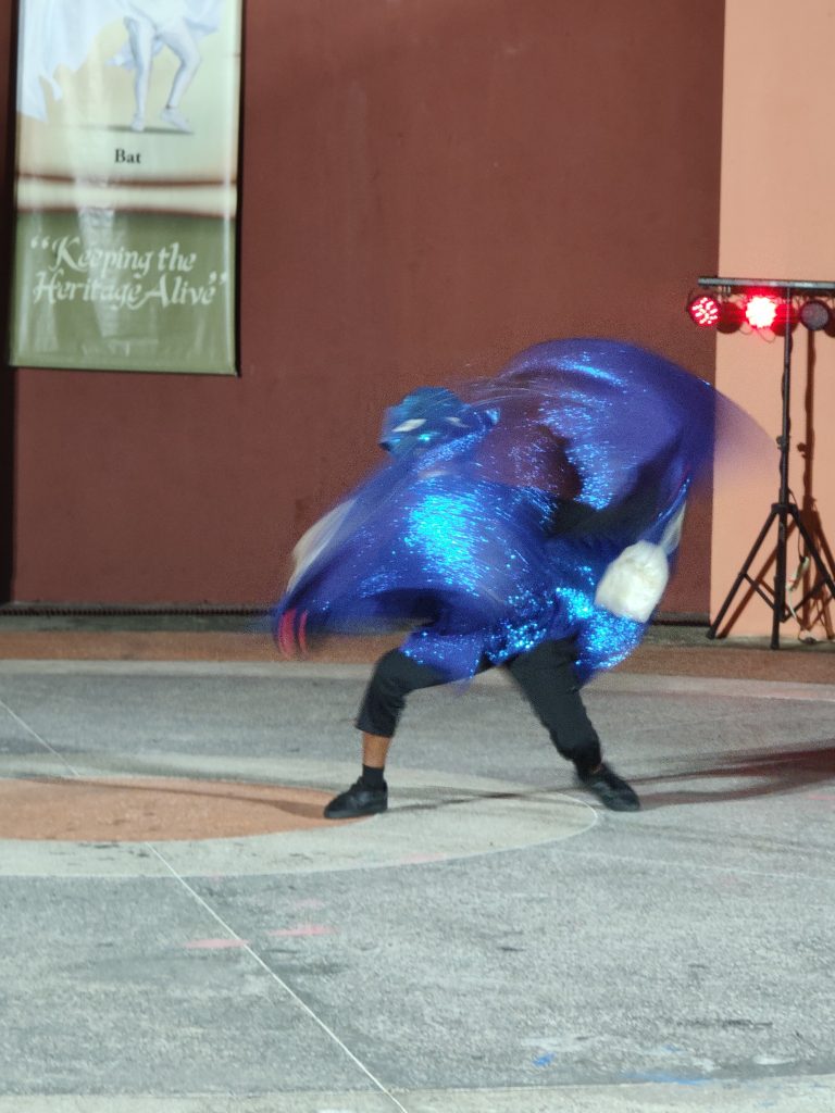 May be an image of dancing and street