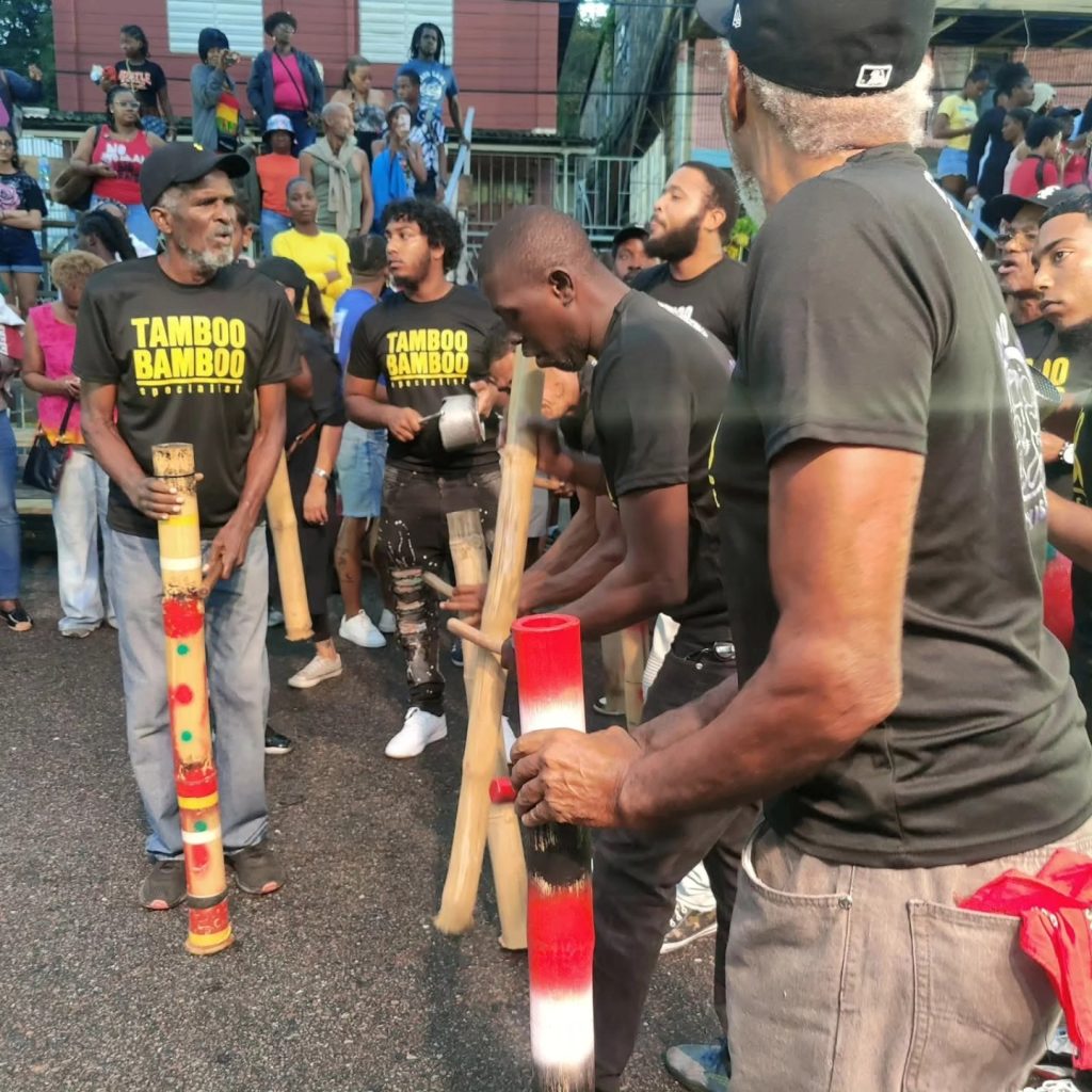 May be an image of flute, crowd and text